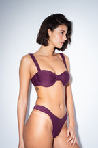 Balconette bikini top by nema swim in purple with adjustable straps and removable cups. Shop now