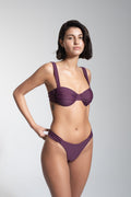 Balconette bikini top by nema swim in purple with adjustable straps and removable cups. Shop now